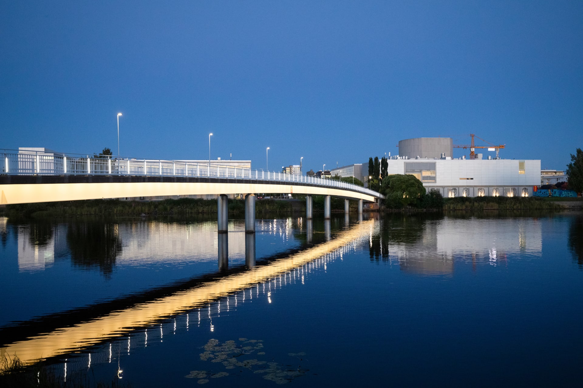 Reflection of the pedestrian bridge in water.