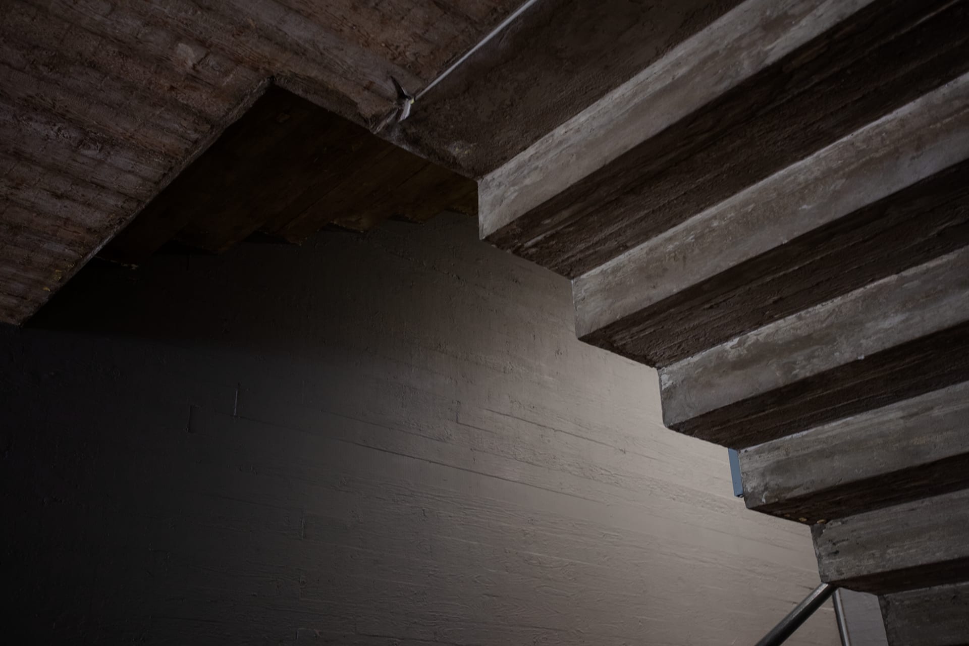 Interior detail of under concrete staircase.
