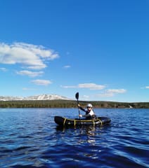 Rafting between hills in spring time.