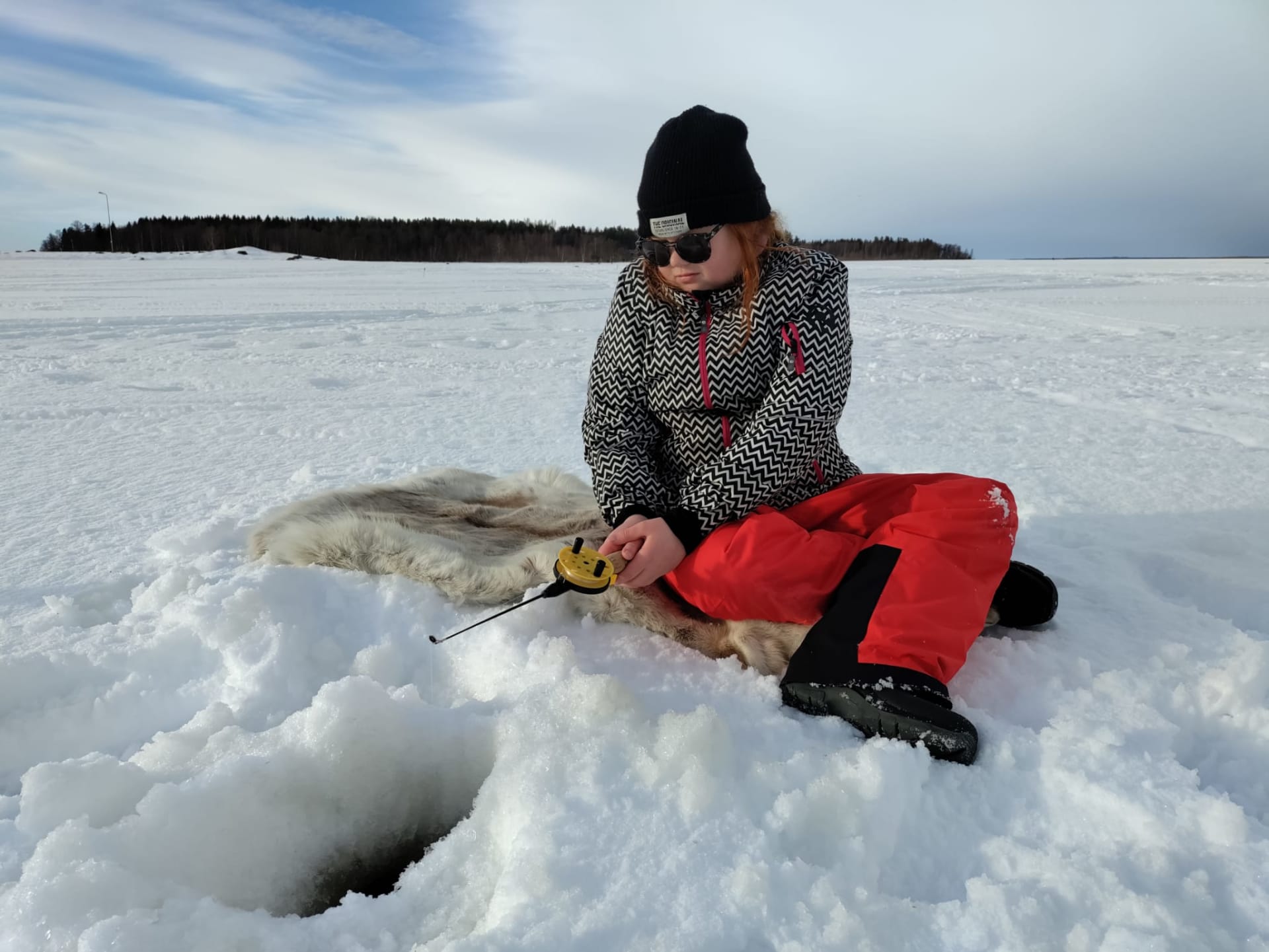 Ice fishing at Bothnian bay