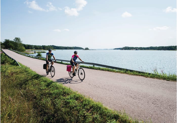 Two cyclist travelling along the Archipelago Trail in summer.