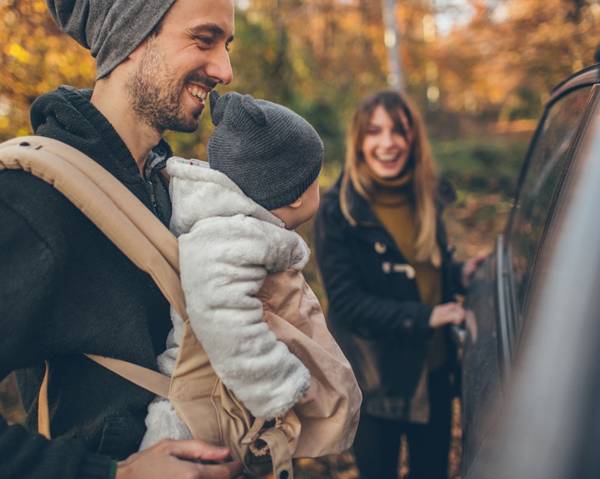 Family with car and baby