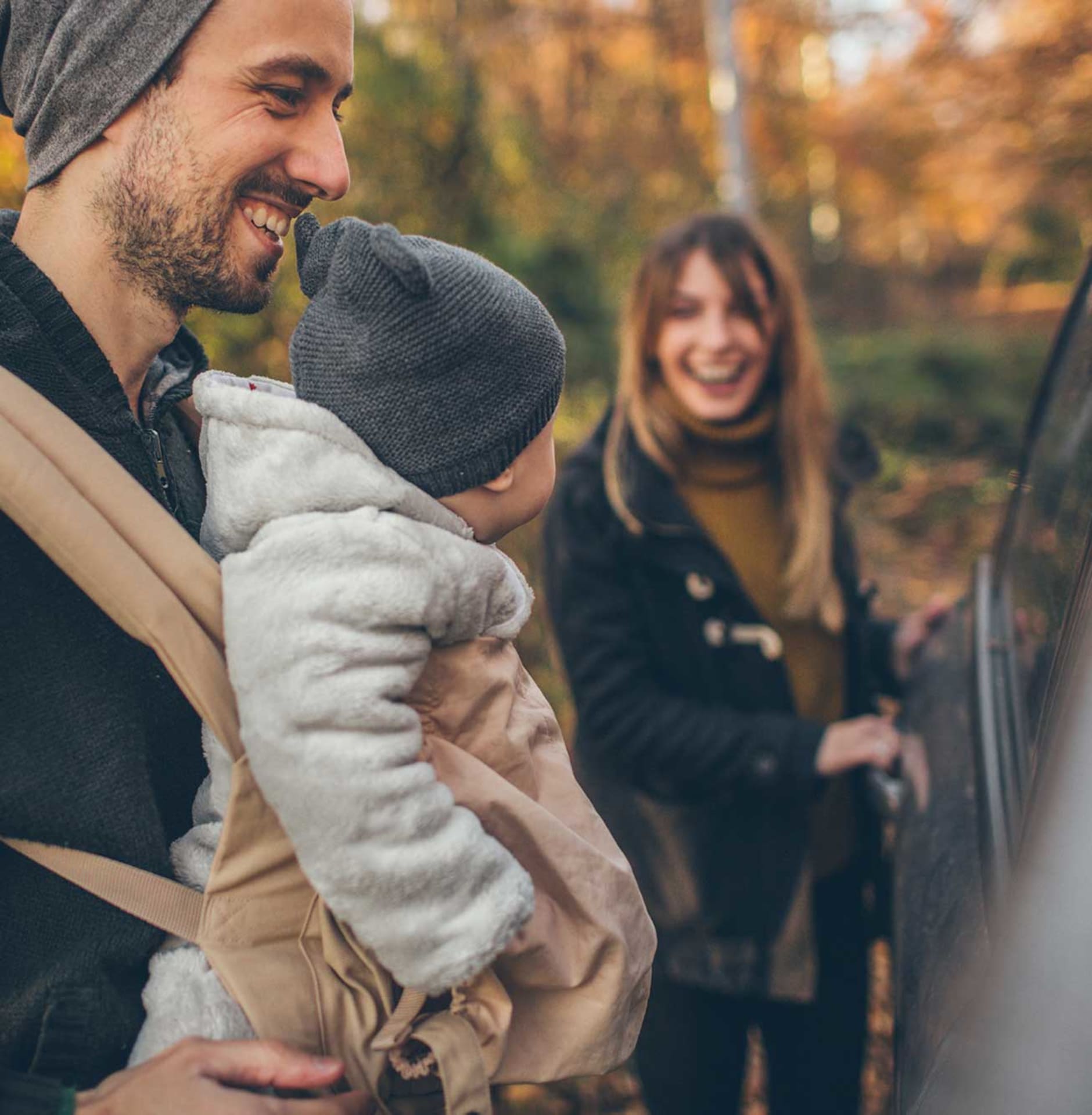 Family with car and baby