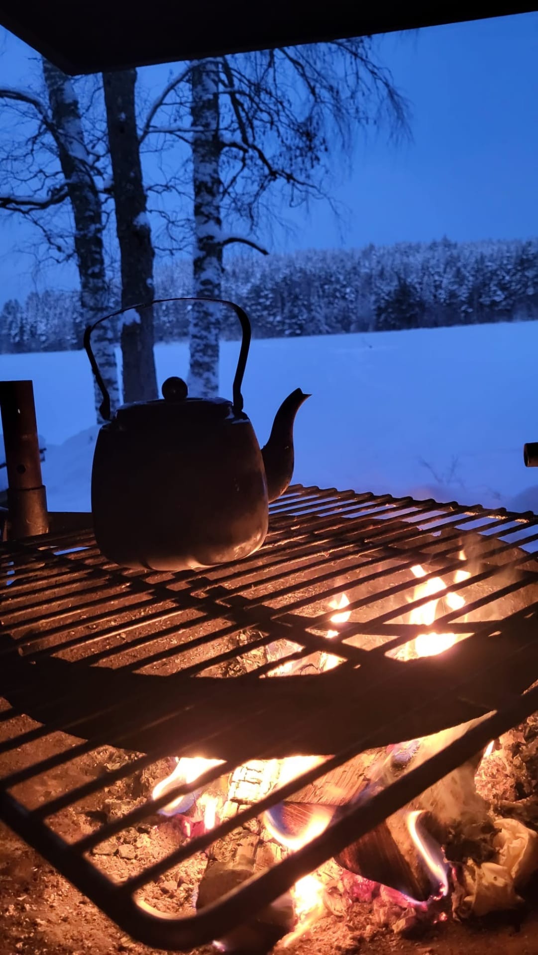 Cofee by the campfire on winter