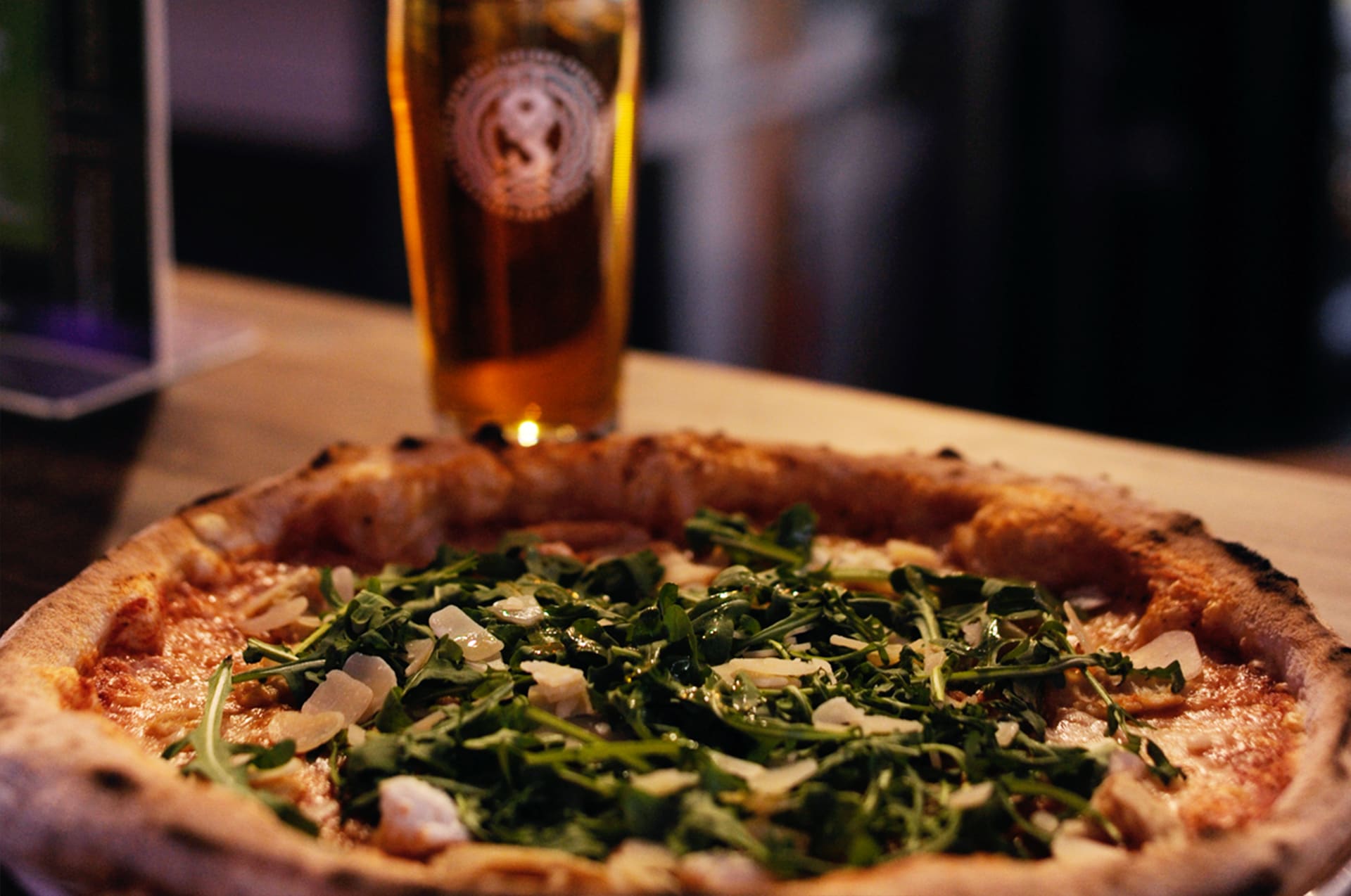 Handcrafted artisan pizza and a pint of local craft beer at Varikko brewery restaurant