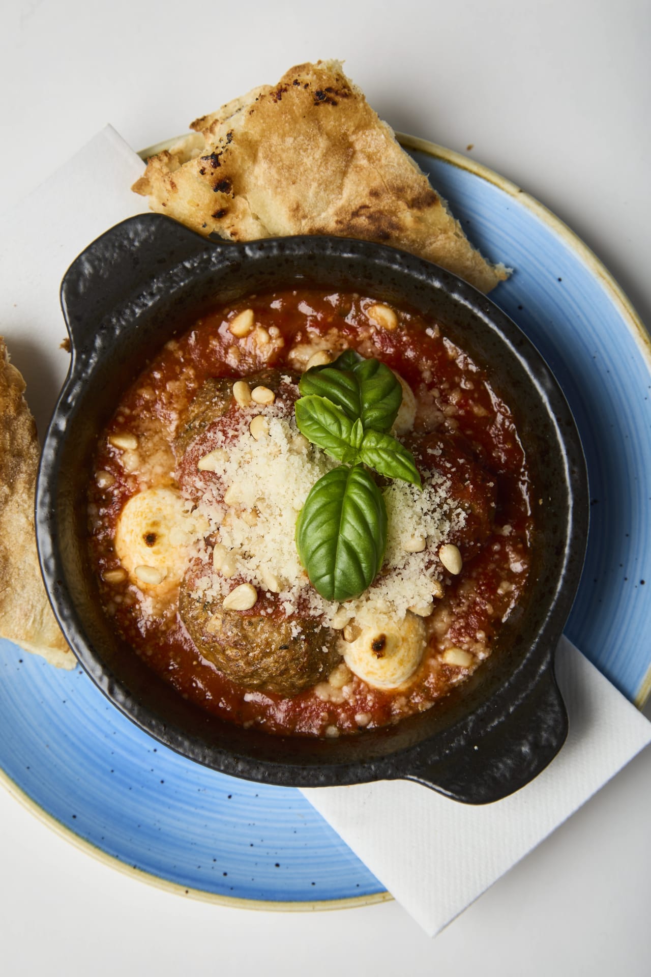 Classic meatballs made with Grandma’s recipe in a sauce of San Marzano tomatoes with mascarpone, topped with parmesan cheese and roasted pine nuts. Served with  toasted garlic sourdough bread.