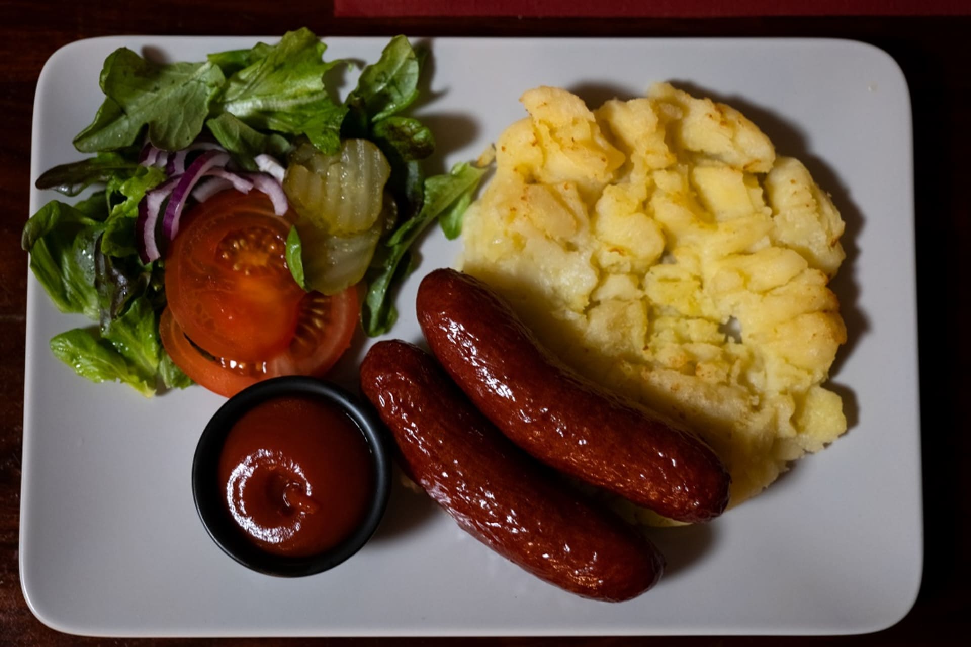 Mashed potatoes, salad and haikku sausages