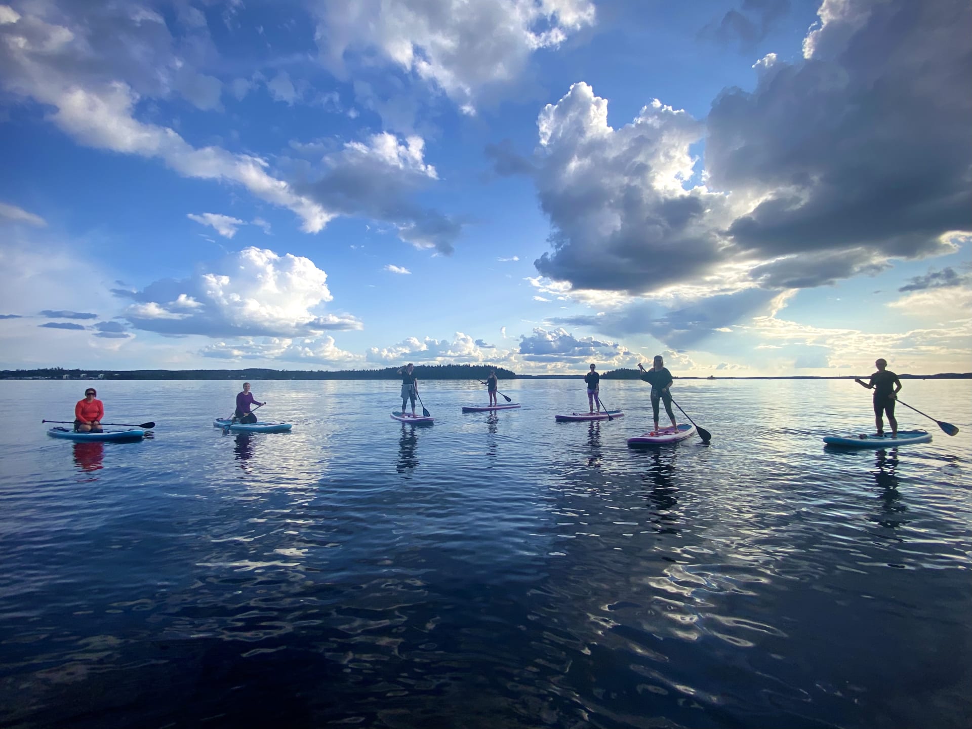 Group of people are stand up paddling on lake Pyhäjärvi.
