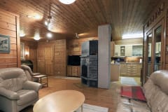 Hiisi Lodge living room offers spacious comfort.