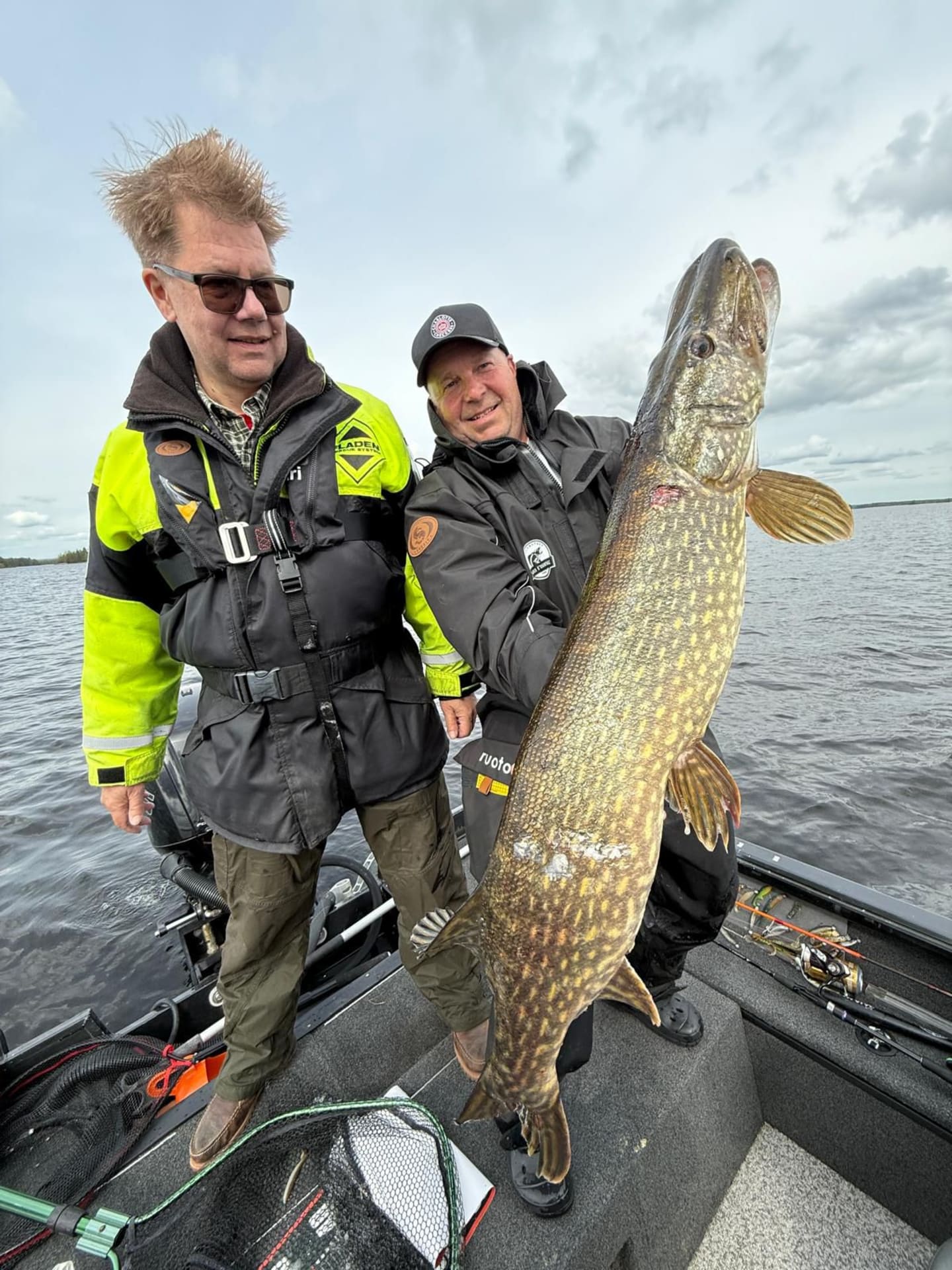 The guide and customer with a big pike