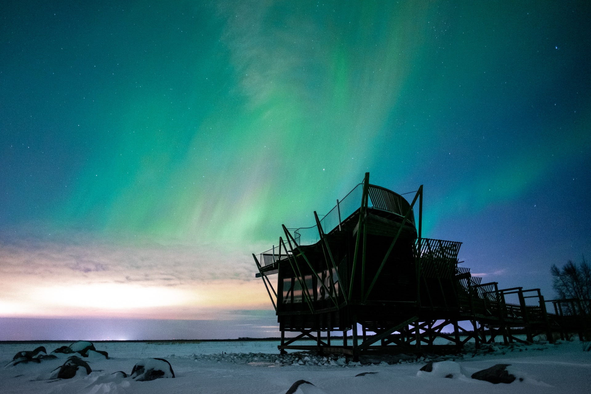 Northern lights at the sky at Virkkula Birdwatching Tower in Liminka Bay.