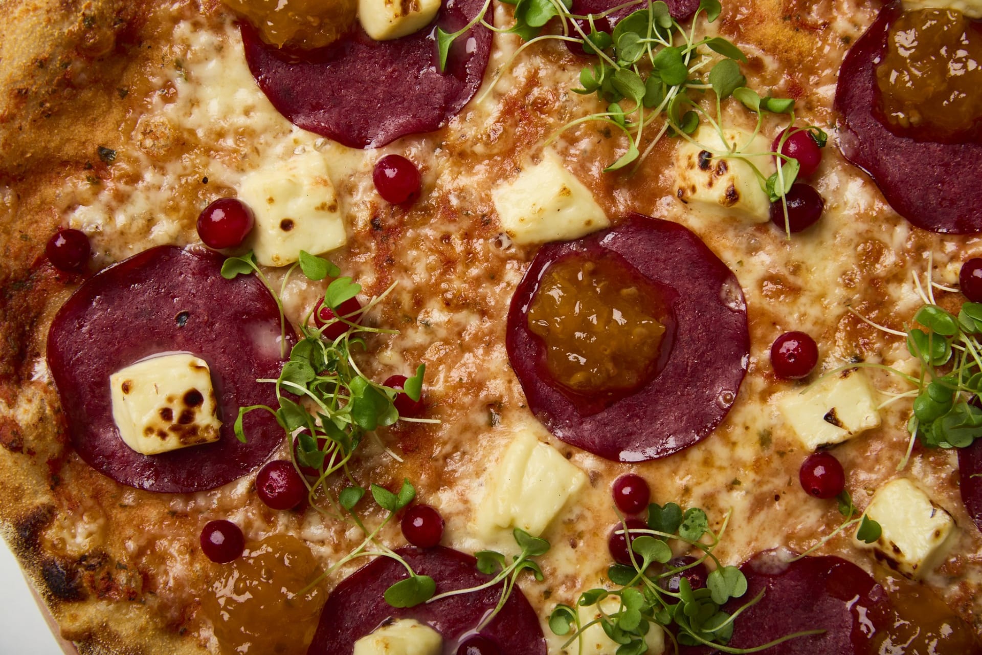 Aurora is a northern-inspired pizza in which contrasts meet in harmony. Cold-smoked reindeer adds a delicate smokiness to the pizza, balanced by soft Finnish squeaky cheese.