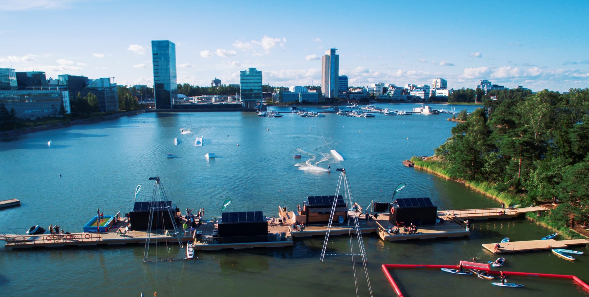 A summery view from the Water Sport Centre Laguuni to Keilaniemi office buildings.