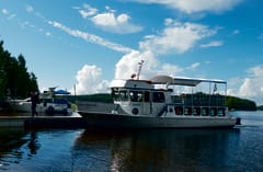 A hiker leaving to spend the night on Kenvenne island.