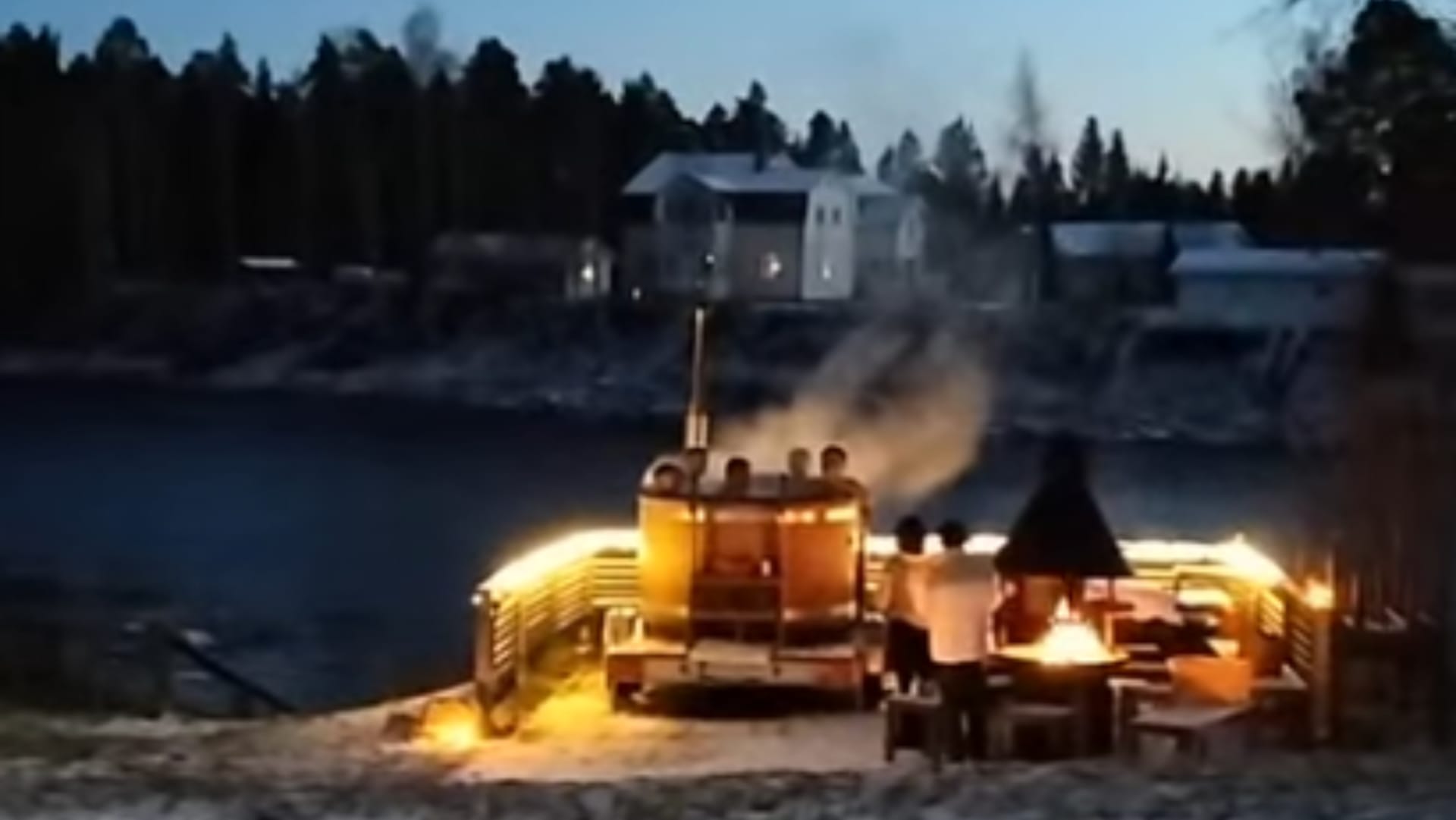 Hot tub by the river with sauna