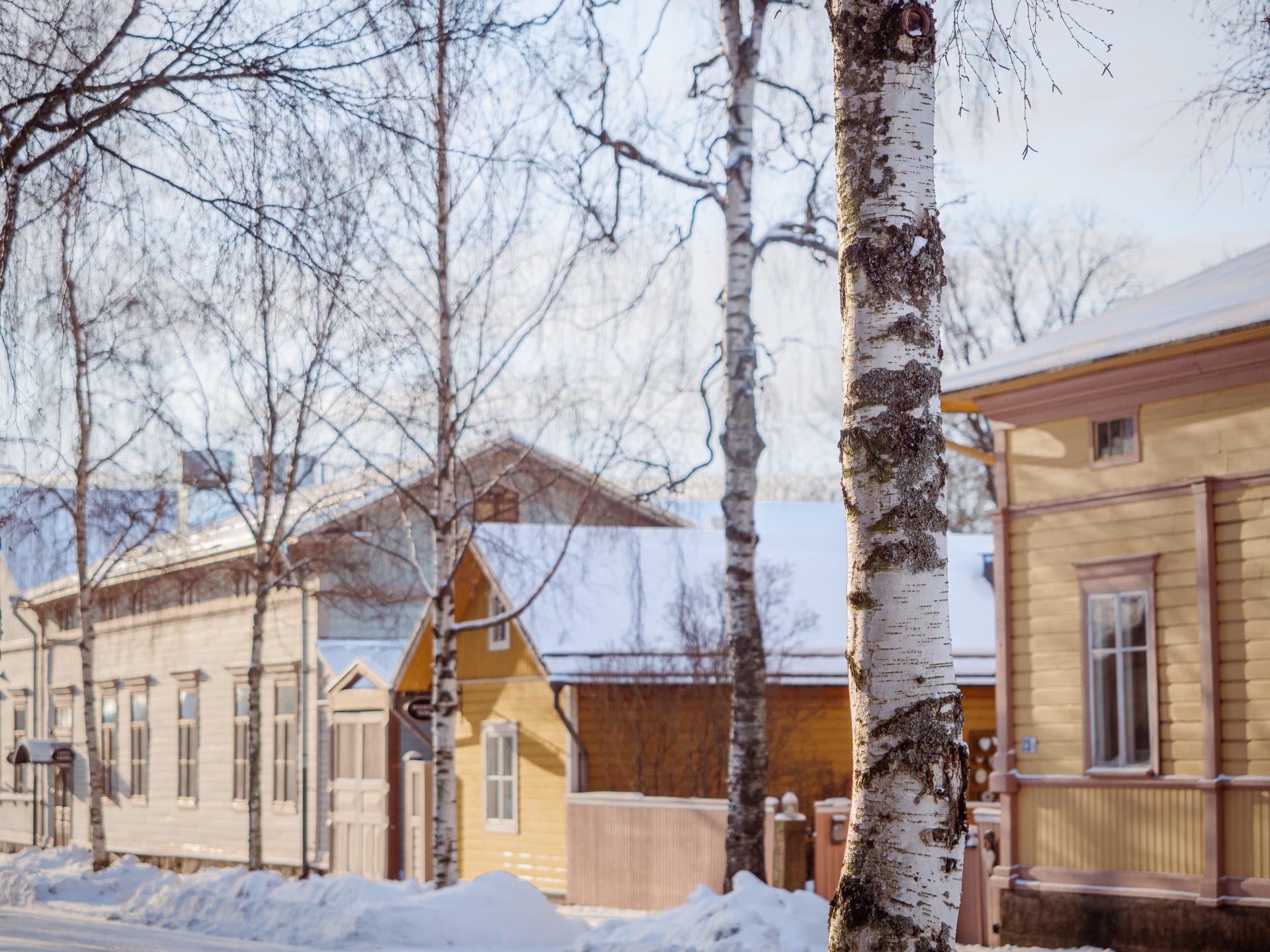 Wooden house street in wintertime