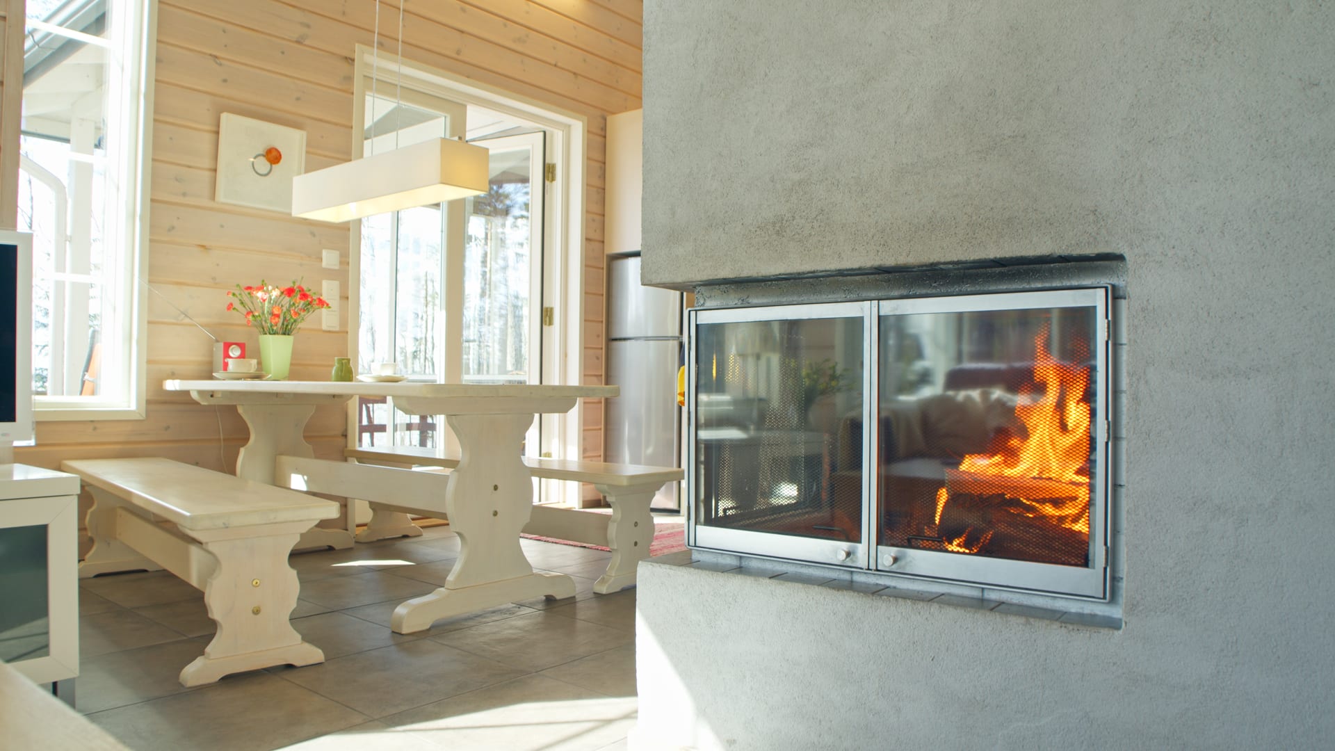 A big fireplace and kitchen table