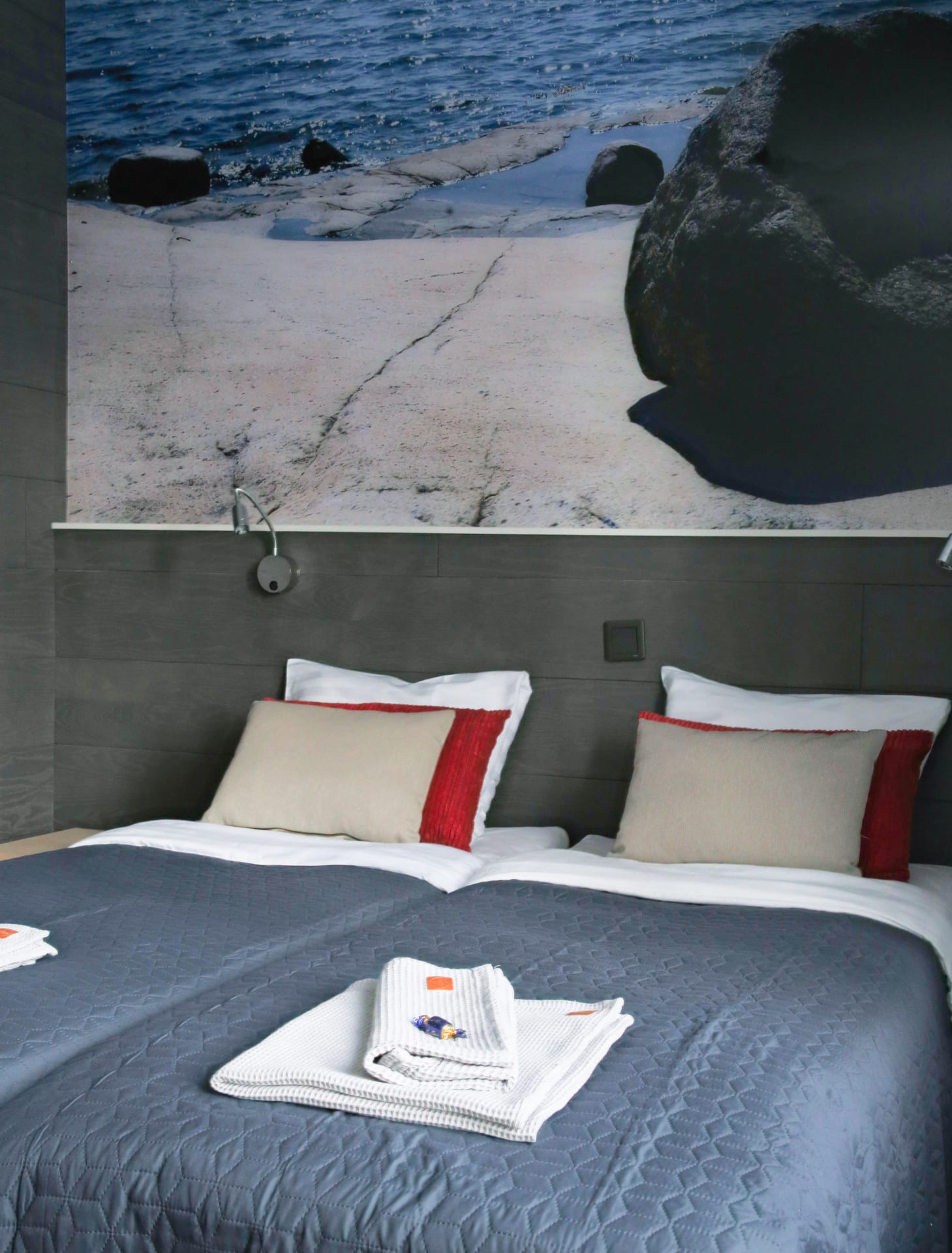 Downstairs room fro two bed and huge picture on the wall.