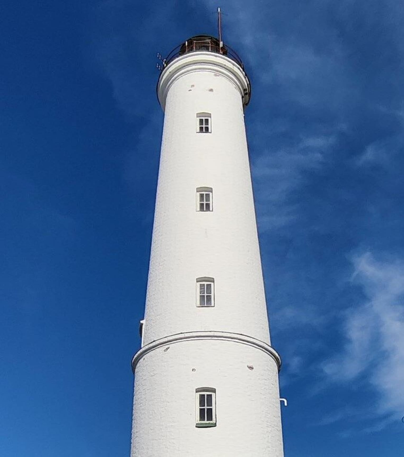 The white lighthouse in Hailuoto Marjaniemi against the blue sky.