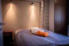 There is a bedroom for two adults downstairs.