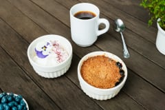 Blueberry rye pie and coffee on the table.