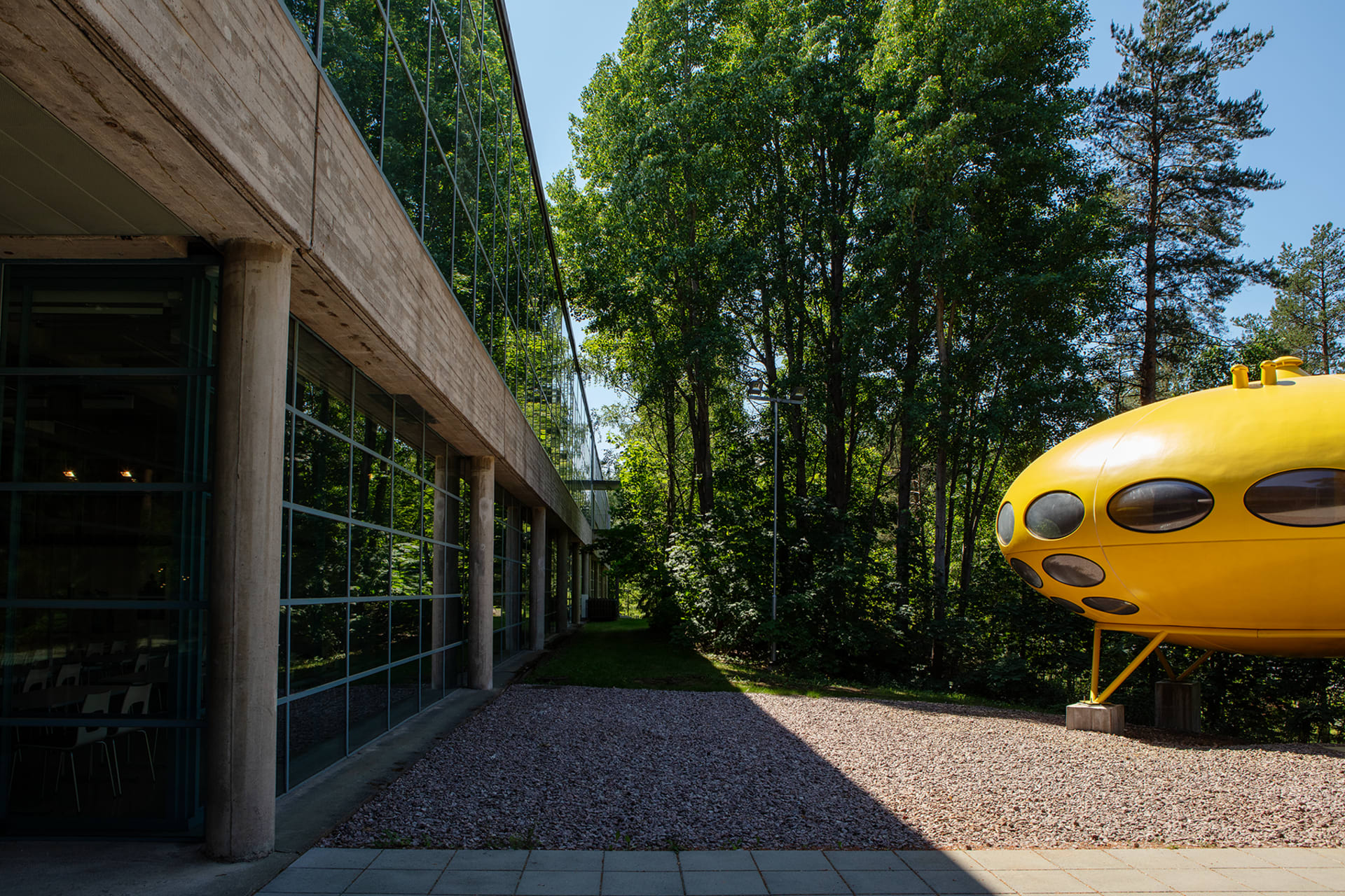 WeeGee house's back facade, with Futuro house showing partly in the picture.