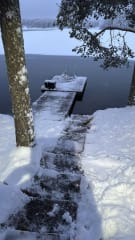 Private ice swimming spot at Villa Hilikkula with direct access from the pier on a frozen Finnish lake.