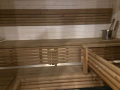 A warm and inviting private sauna at Villa Hilikkula, perfect for unwinding after a day outdoors.