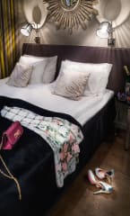 Classic room with a scarf and purse on bed