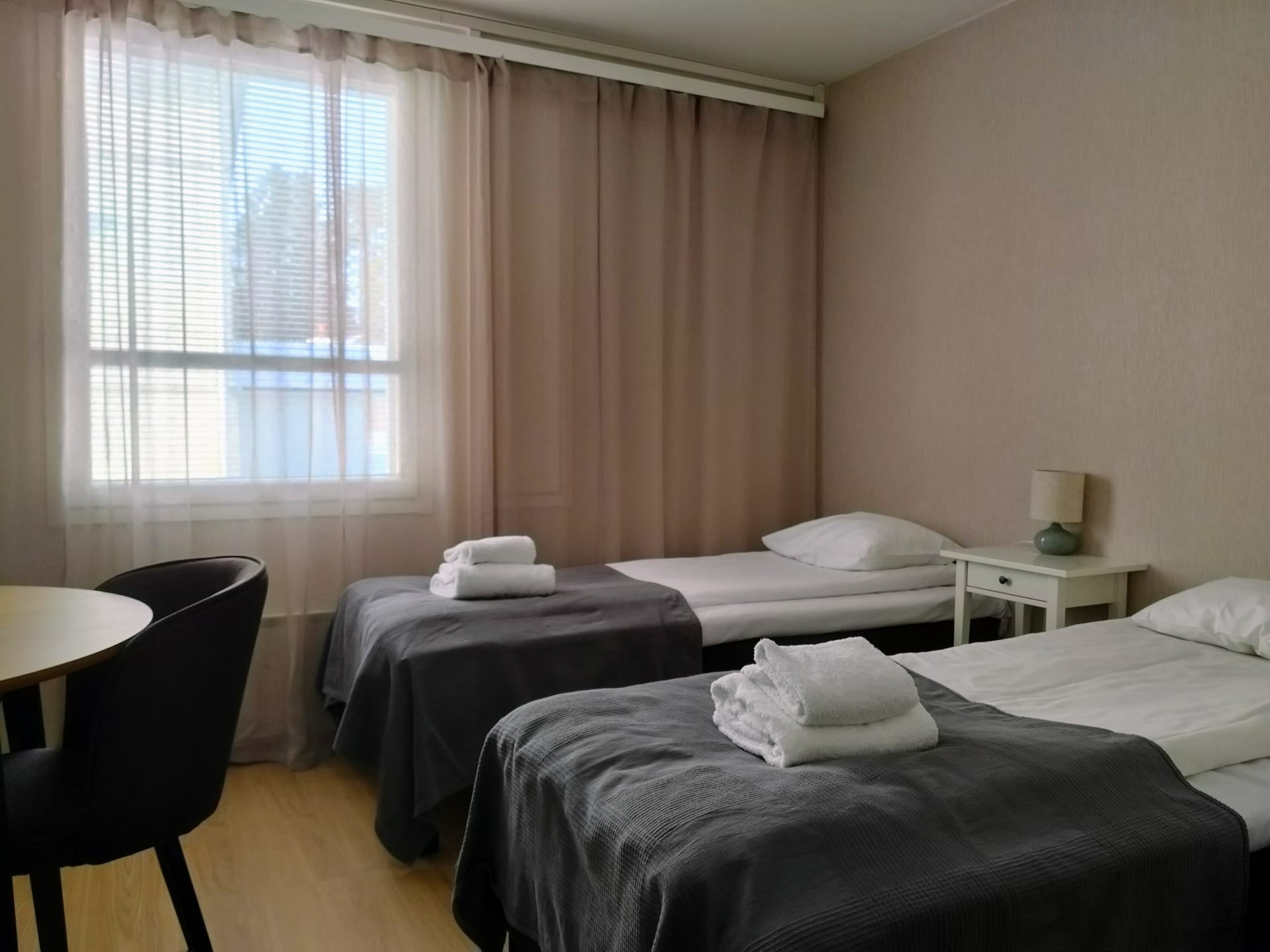 Rooms with bed linen and towels