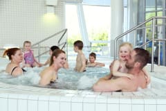 Family in a Jacuzzi at Vesihelmi Spa