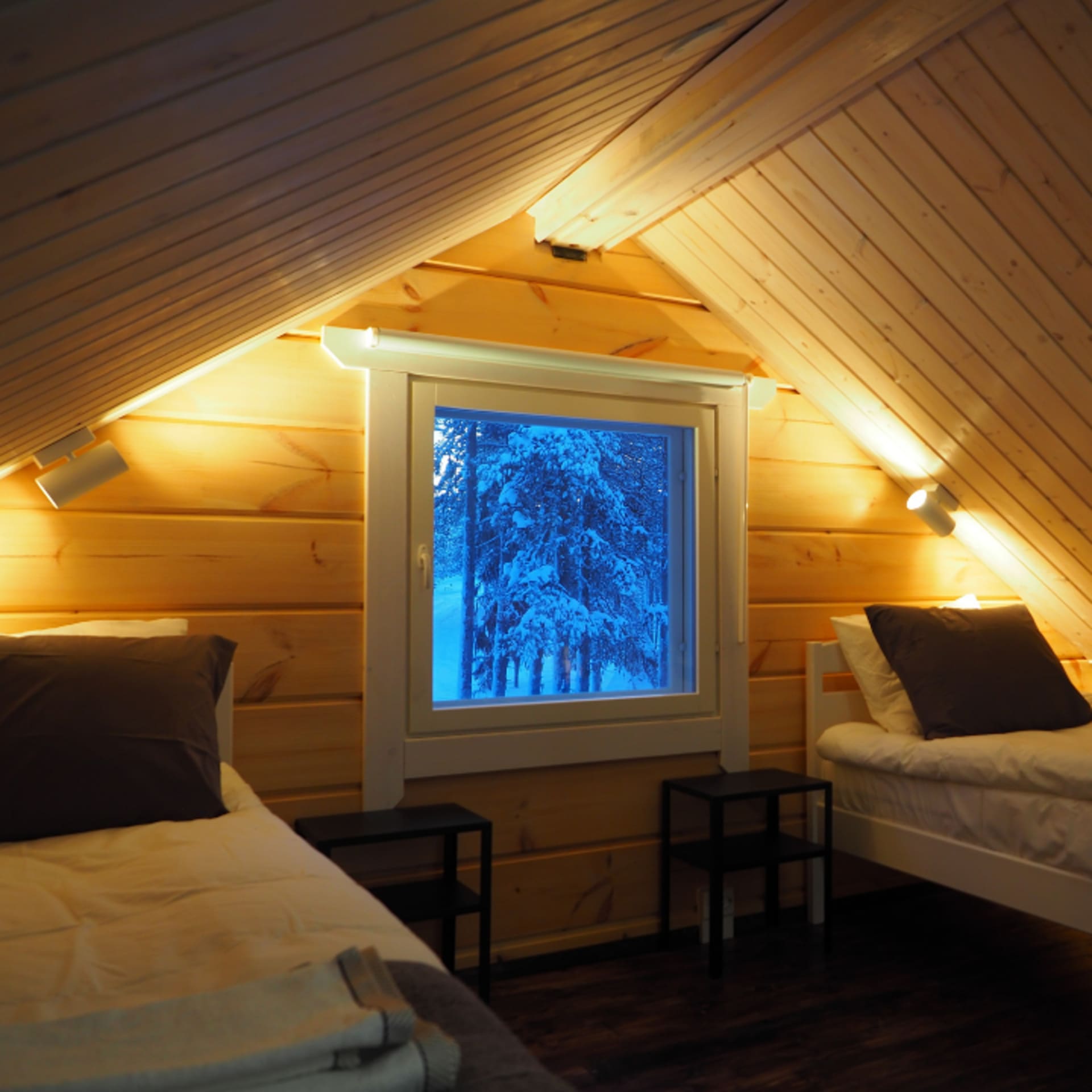 Beds are on a small loft in LapinTintti Eco-Cabin. 