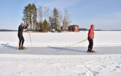 People ice skating on Lake Saimaa archipelago