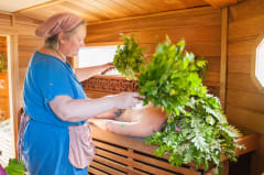 Sauna treatment with Finnish vihta made of birch and rowan leaves