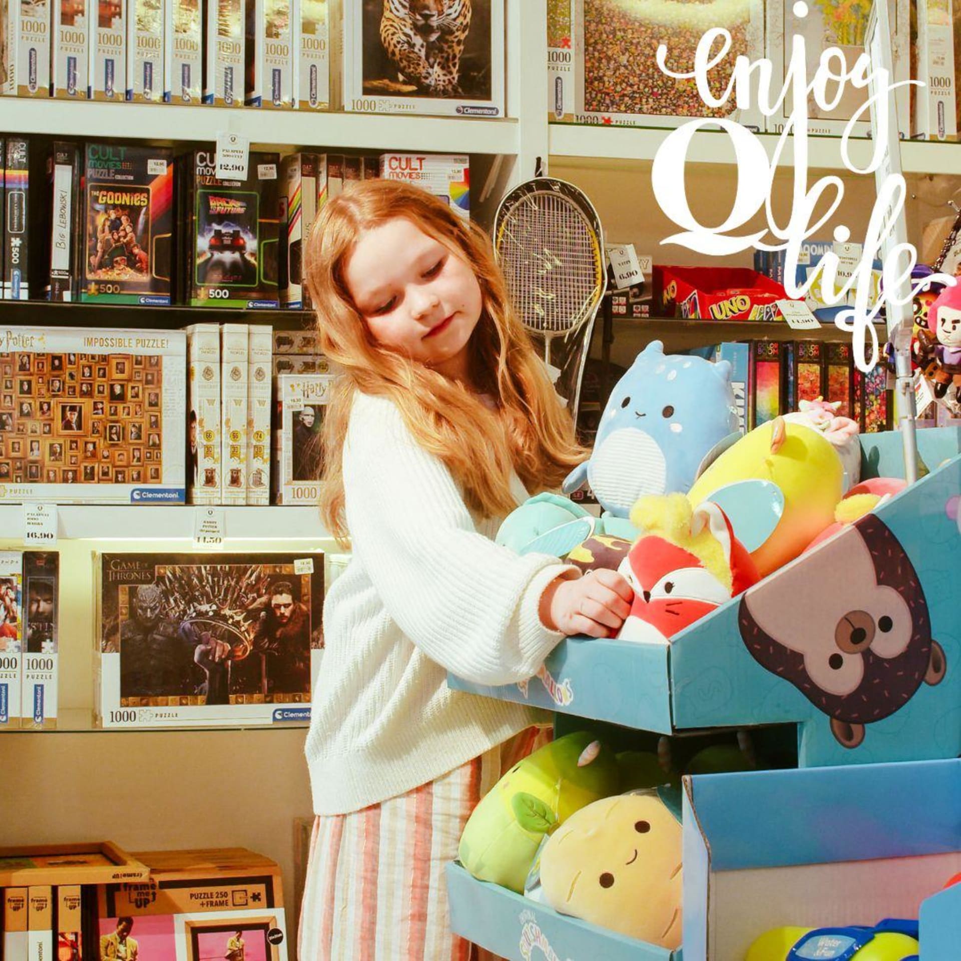 child touching soft toys