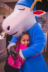 A child is hugging the sleepwalking Mr. Clutterbuck.