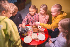 Children are playing house in the home of Mr. Clutterbuck.