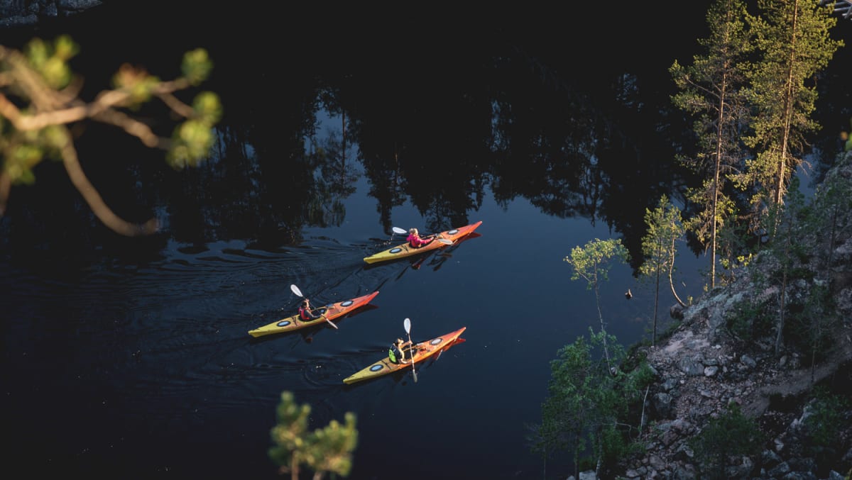 Canoeing trip to Julma-Ölkky lake in sunset