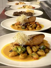 Grilled salmon, gnocci and crab sauce.