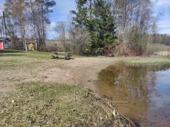 Beach area, toilet and a table