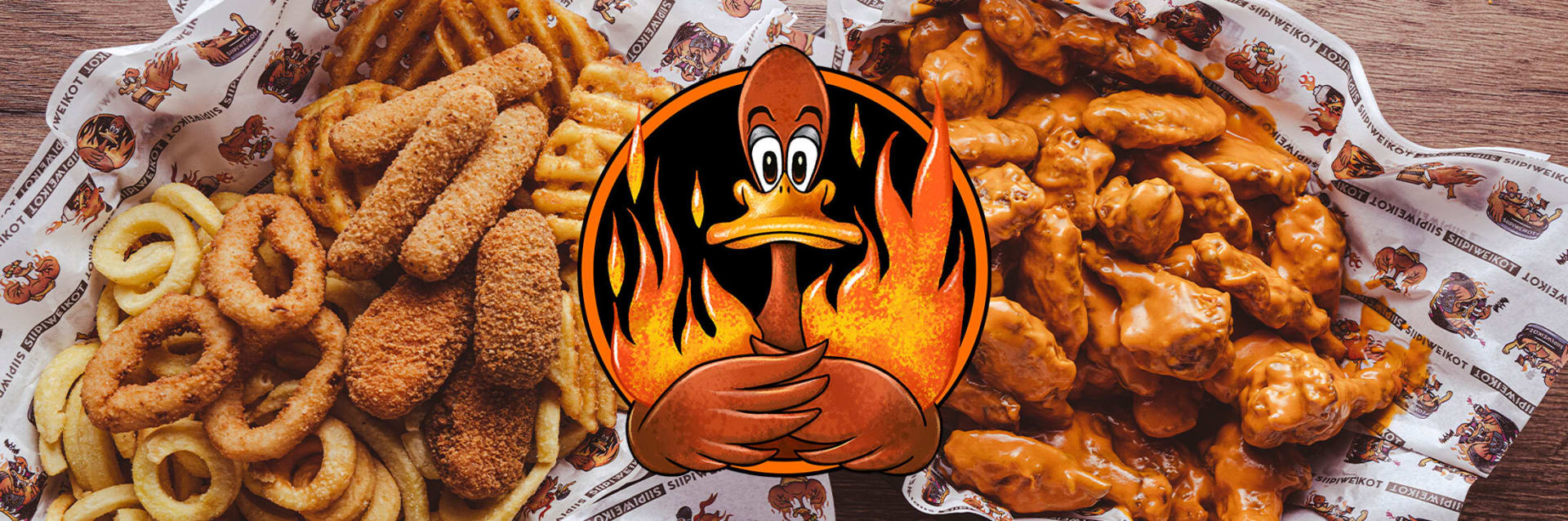 Crispy chicken wings coated in buffalo sauce on the right. Onion rings, fries, and breaded snacks on the left. Siipiweikot flaming chicken logo in the center.