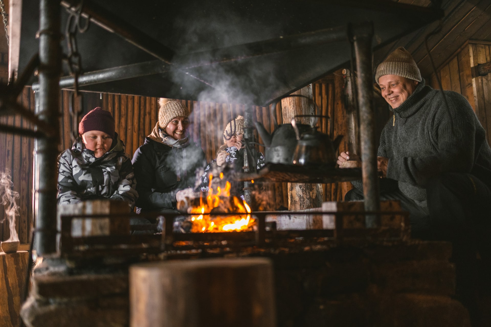 Metsäkartano Youth Centre family holiday winter campfire
