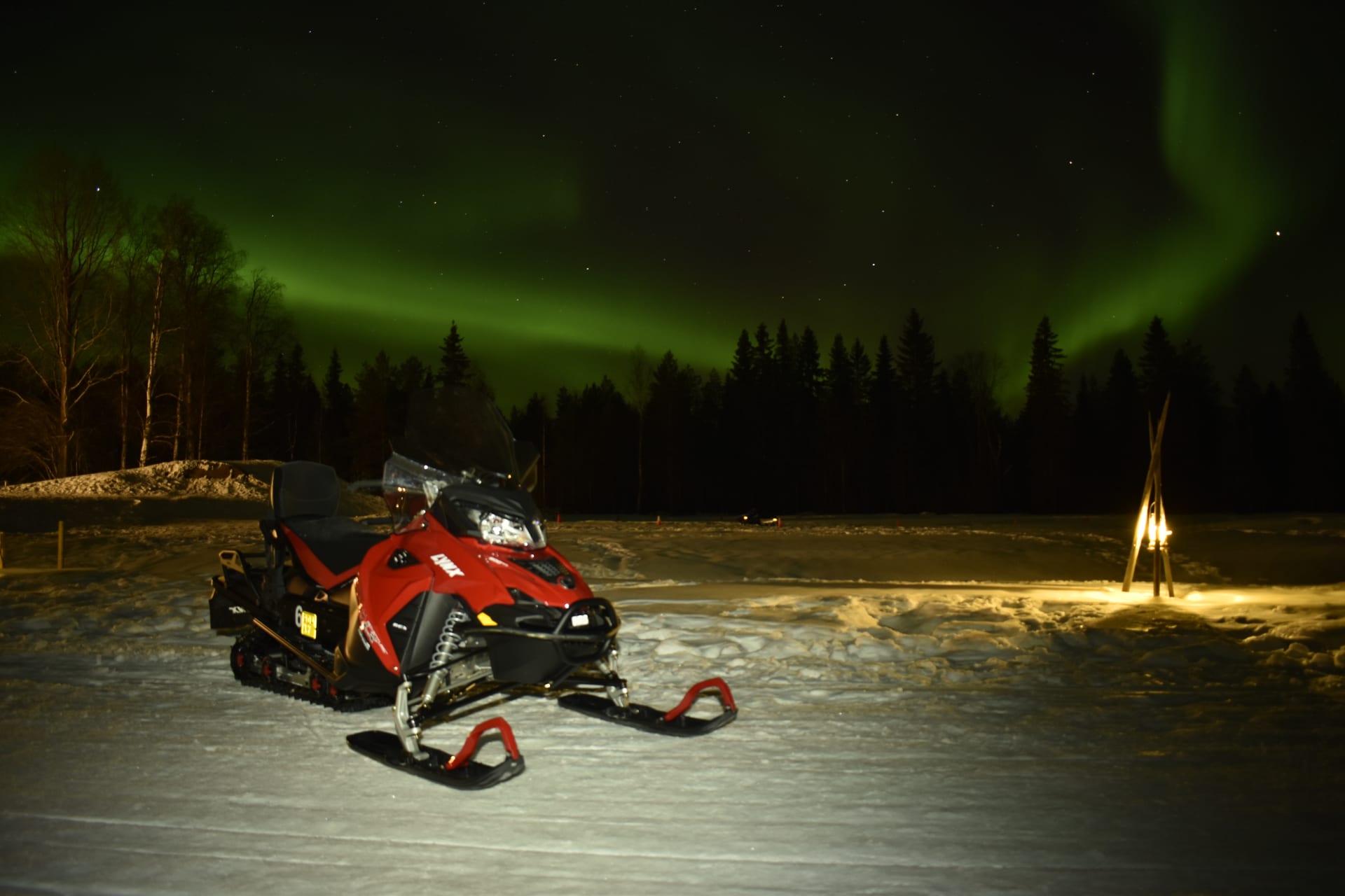 Night-time snowmobile safari in search of the Northern Lights.