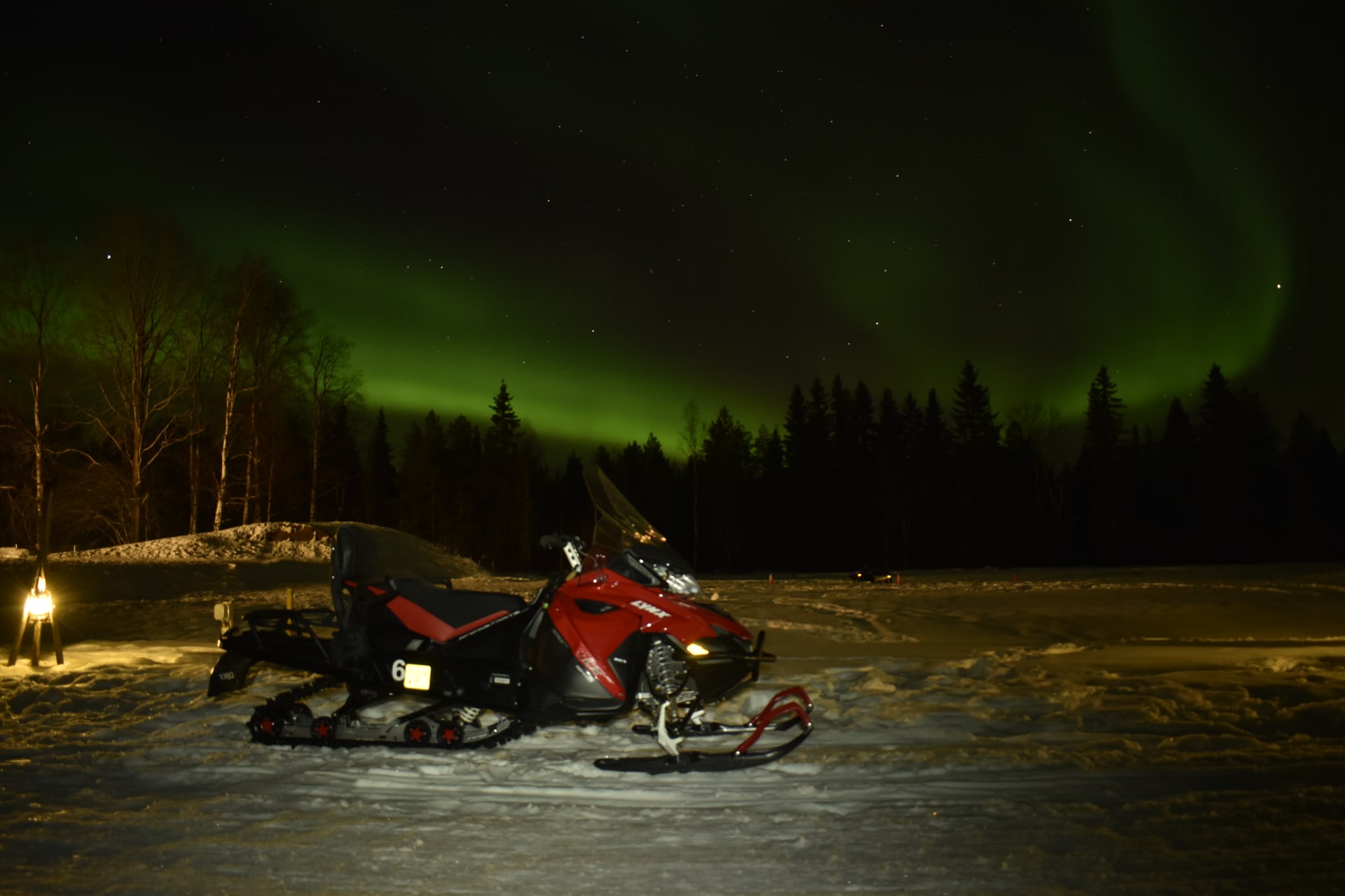 Night-time snowmobile safari in search of the Northern Lights.