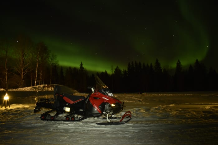Night-time snowmobile safari in search of the Northern Lights.