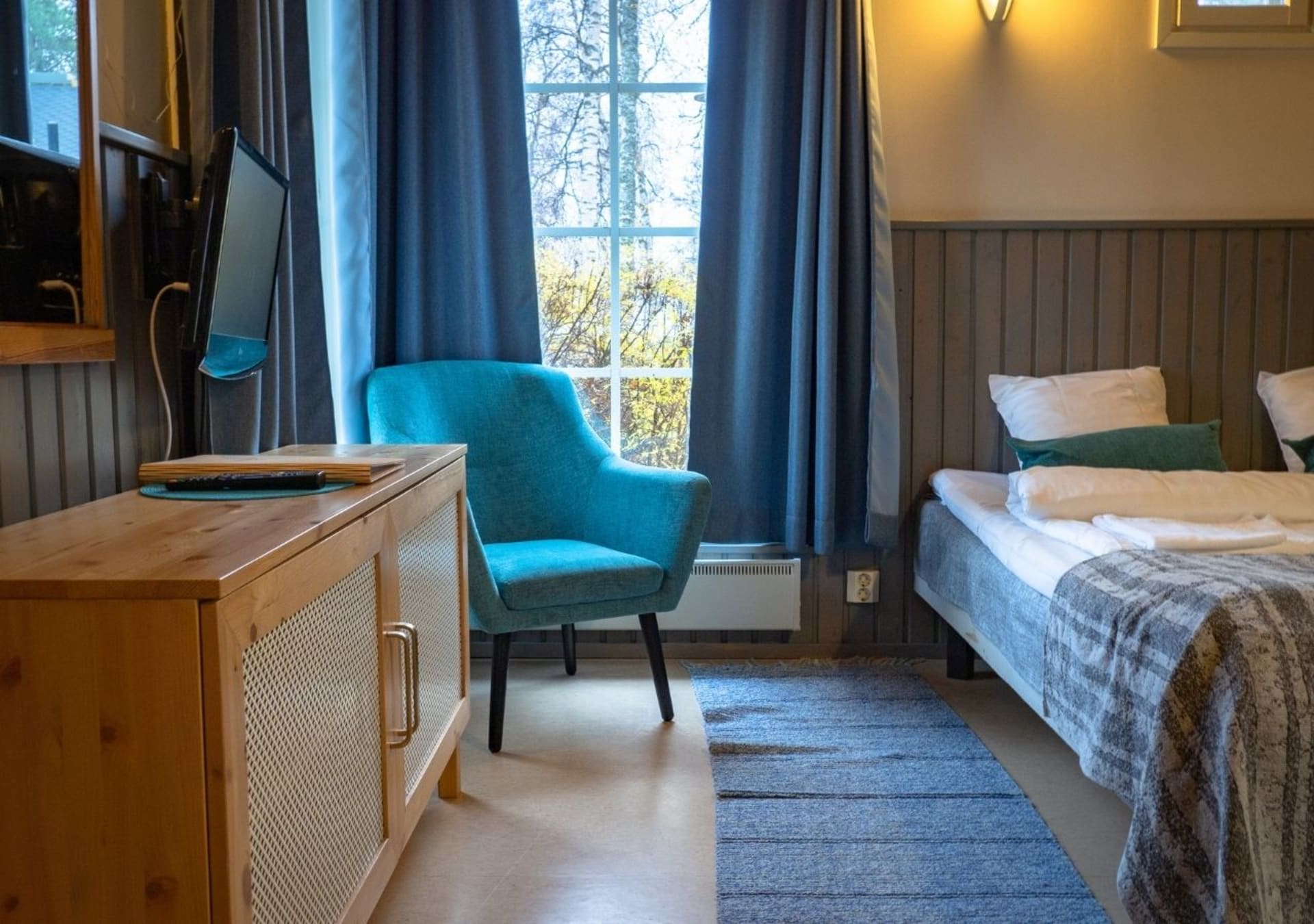 Studios have two beds in the combined living room and kitchen area.