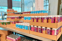 A close-up view of the diverse and creative label art on various Varikko craft beer cans