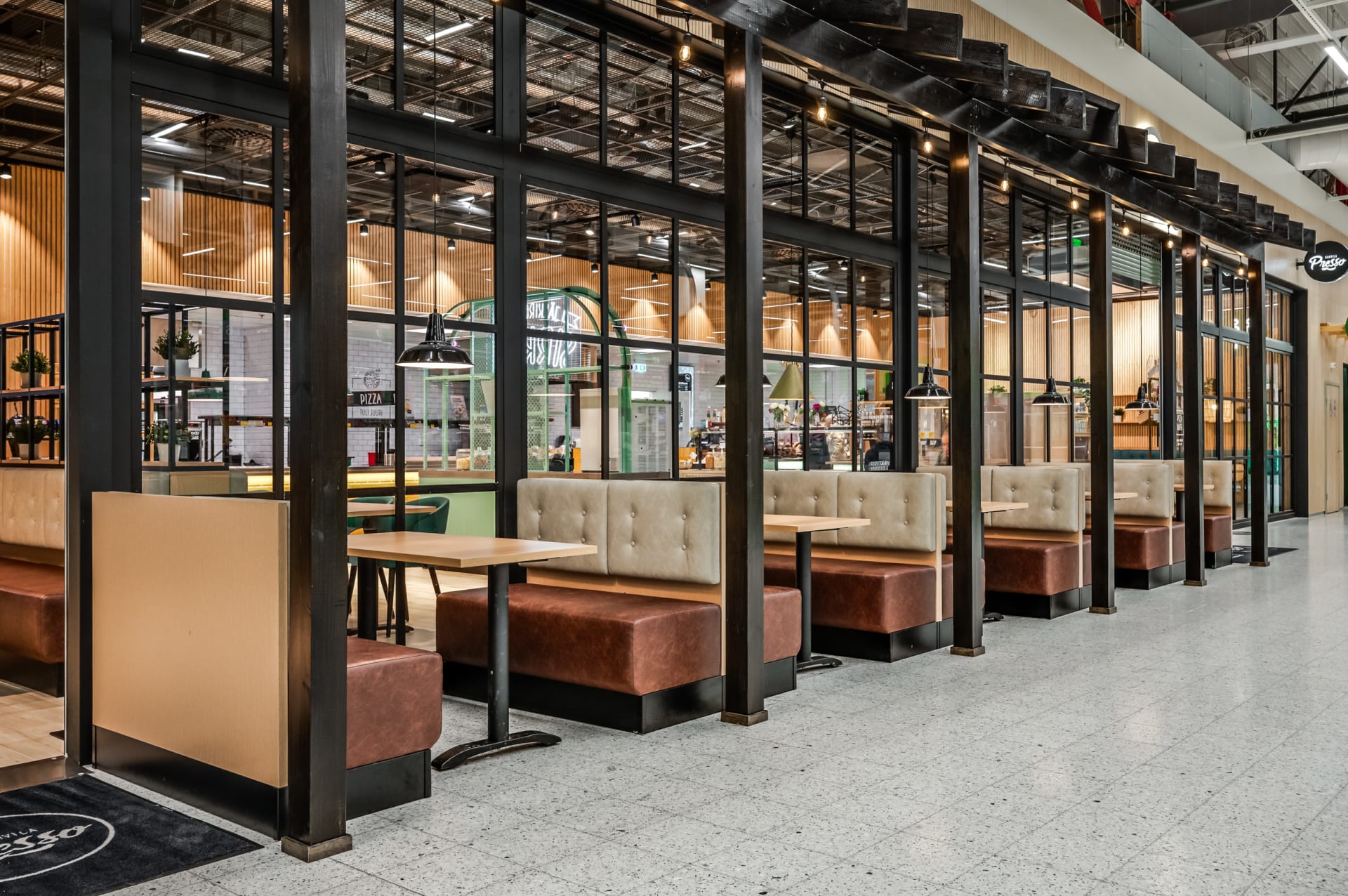 Restaurant’s indoor terrace located in the mall corridor