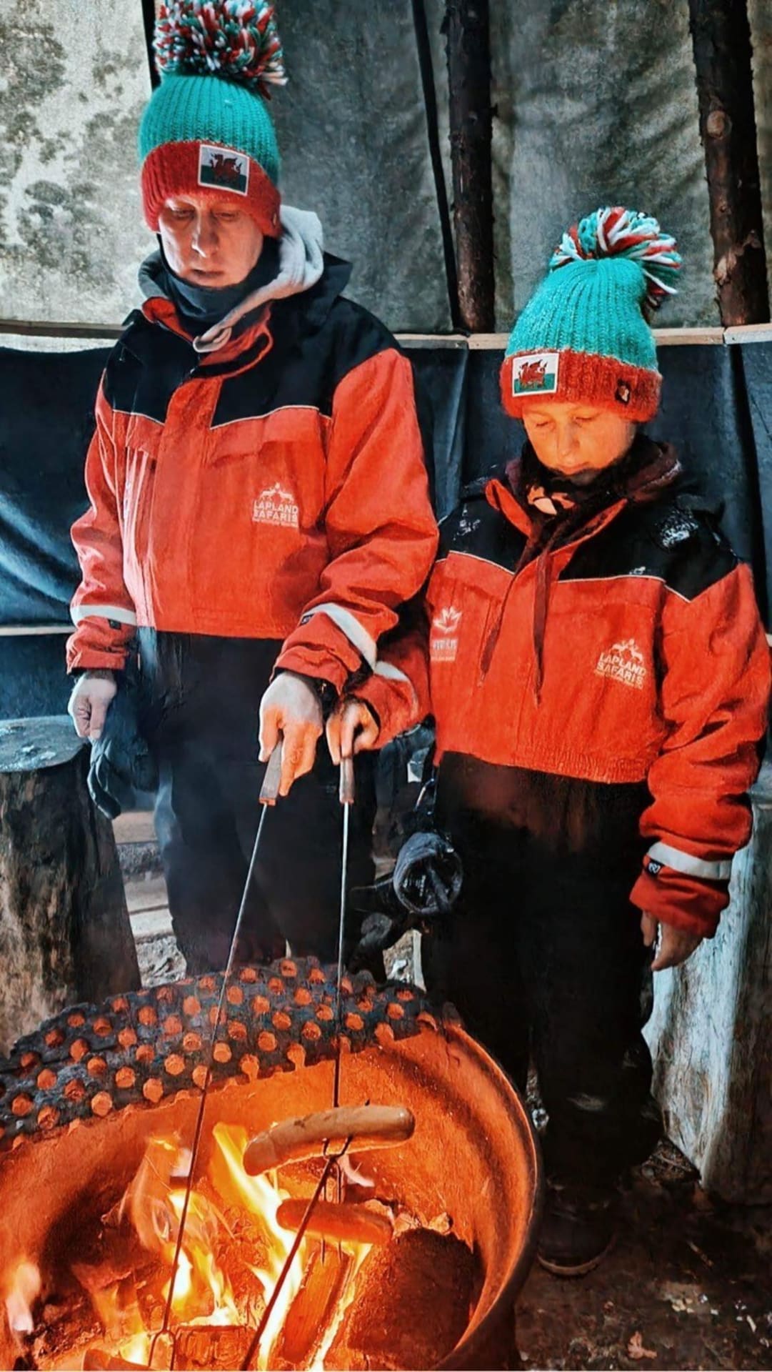 Father and son toasting sausages in Kotatieva