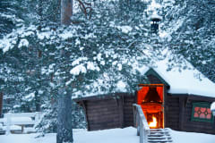 A cozy hut with camp fire in Virpiniemi.